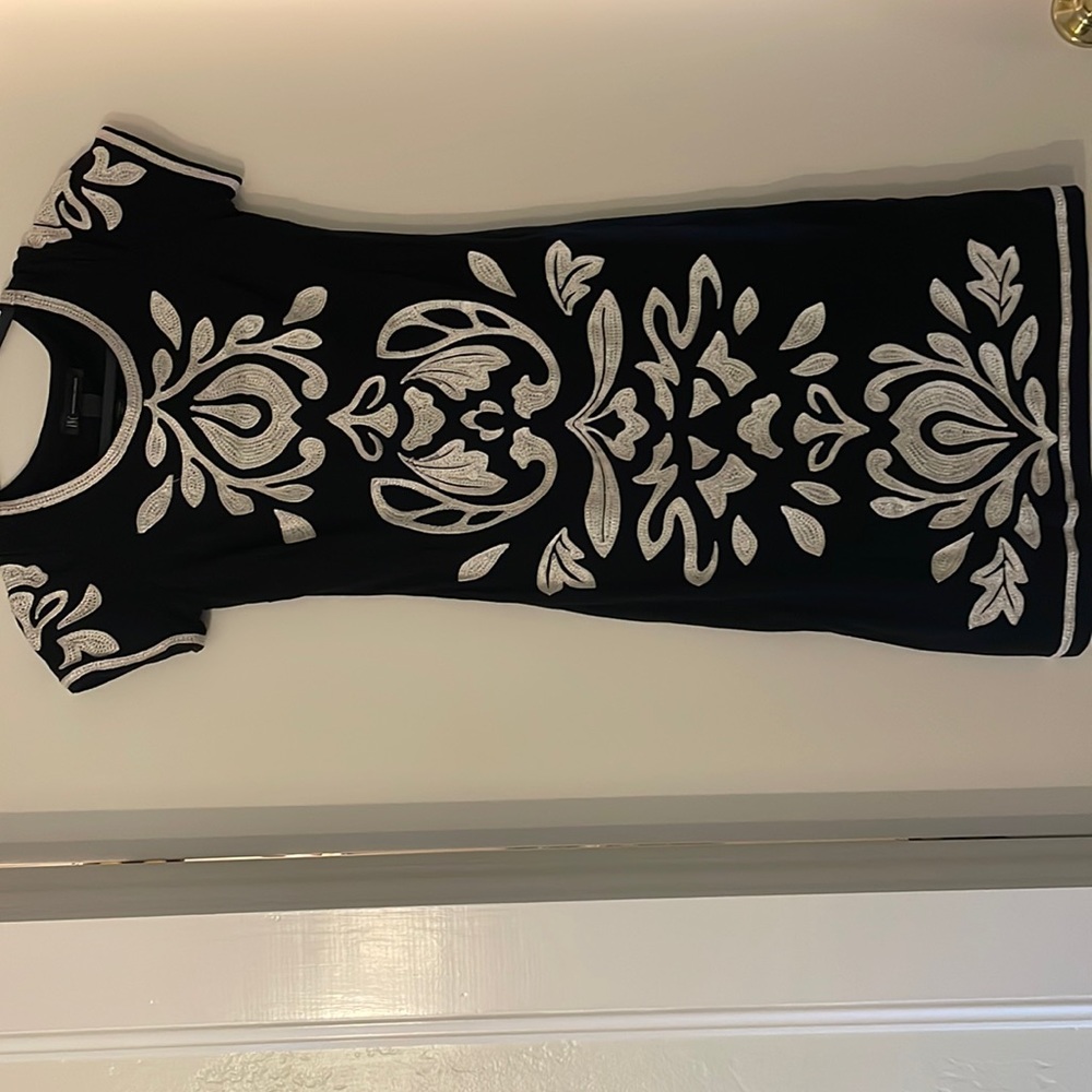 INC dress with beautiful embroidery. Fabric sits nice on a small frame